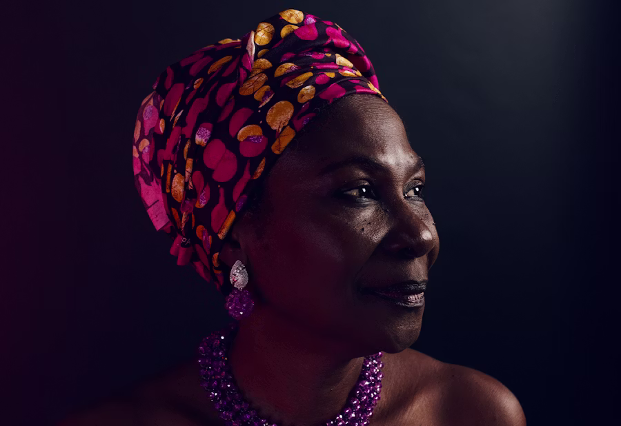 Portrait of a woman in a colourful headwrap
